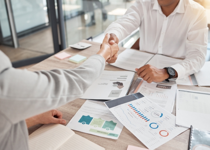 A professional writing an engaging B2B LinkedIn post on a laptop.