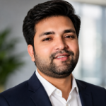 Portrait of MD Mamun, Lead Digital Marketing at OveliTHub, in a dark suit in a bright office