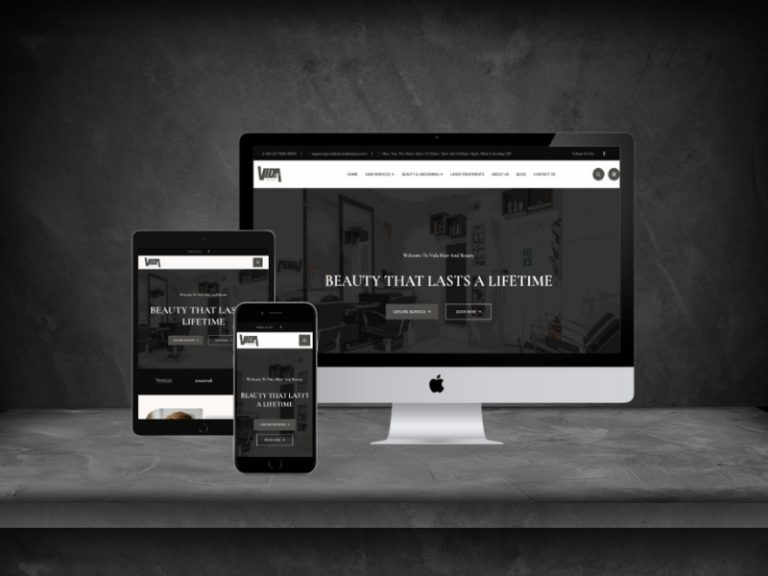 The Vida Hair and Beauty salon website shown on an iMac, a laptop, a tablet and a phone