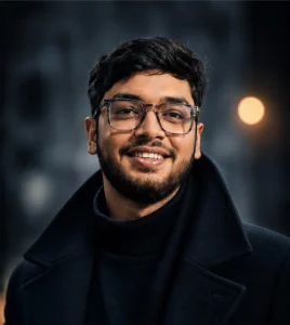 Portrait of MD Laden Islam, Founder and CEO of OveliTHub, wearing glasses against a dark background