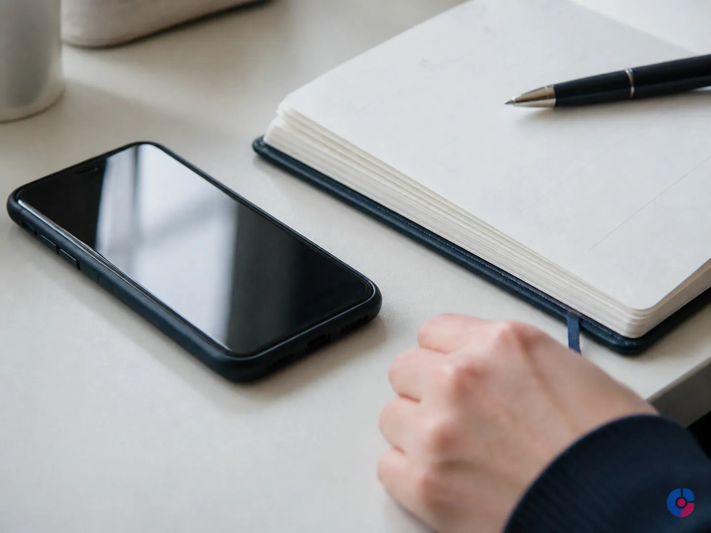 Diary and phone on a desk during appointment confirmation and reminder follow up