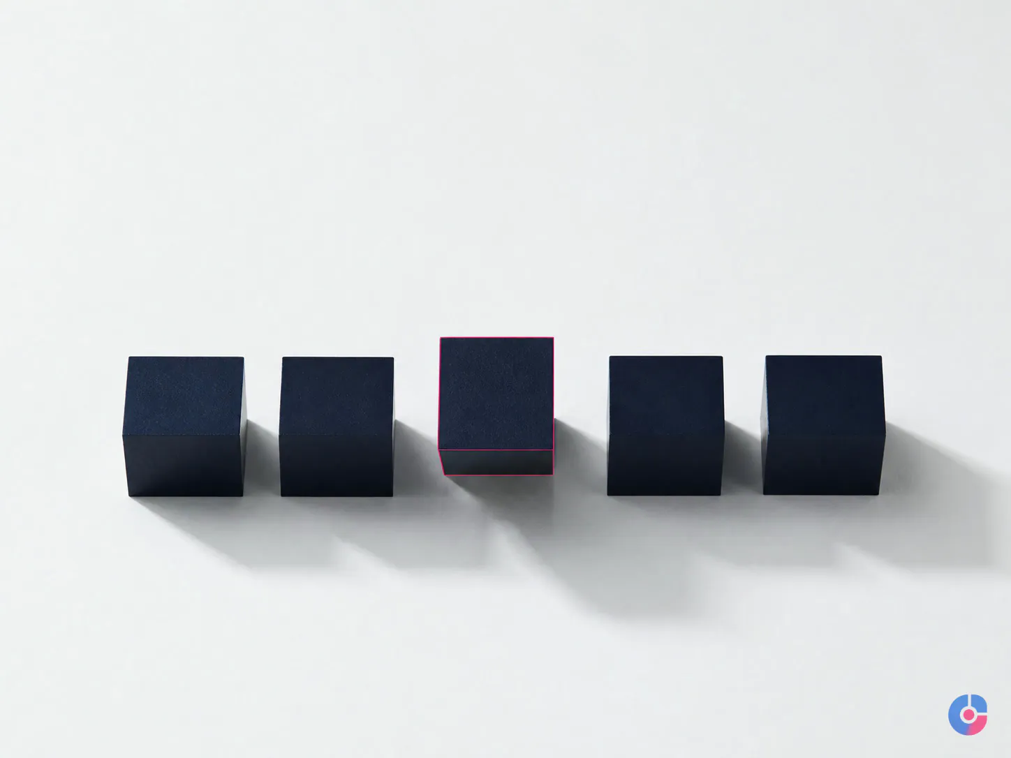 Even row of blocks with one raised representing a dedicated employee and continuity