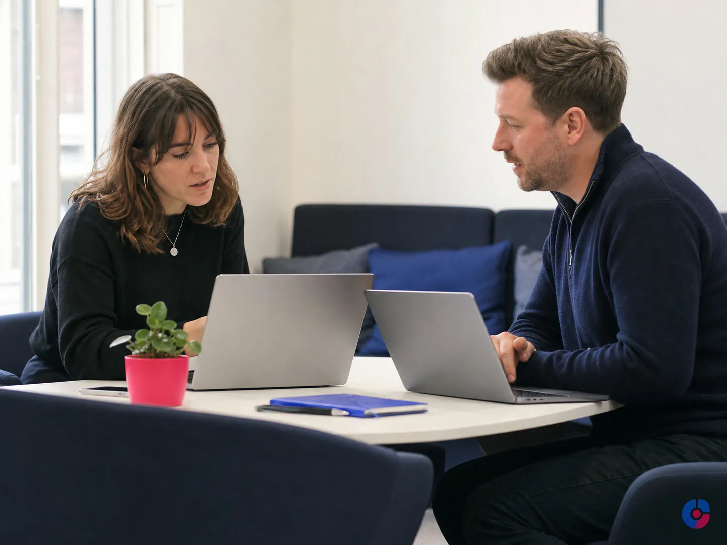 Marketing and finance colleagues reconciling reported leads against recorded revenue
