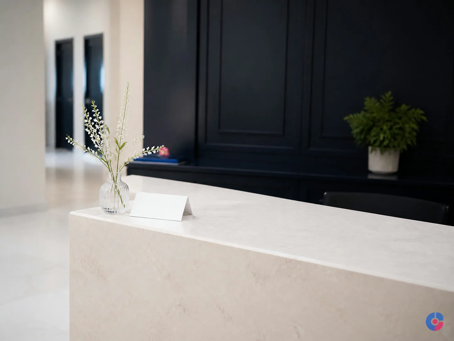 Uncluttered private clinic reception desk in soft natural daylight