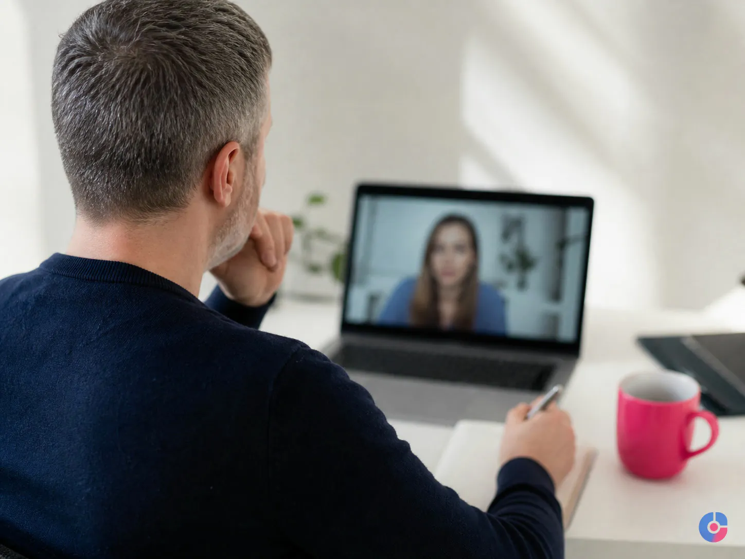 Manager holding a daily onboarding check-in call with a new remote employee