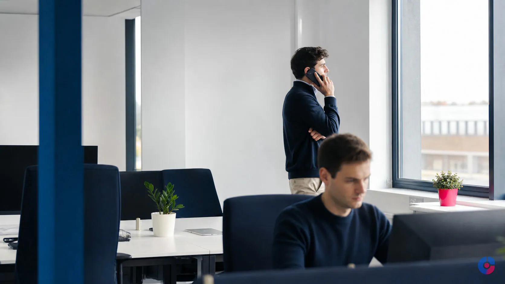 B2B seller on a call while remote sales support handles research and CRM updates