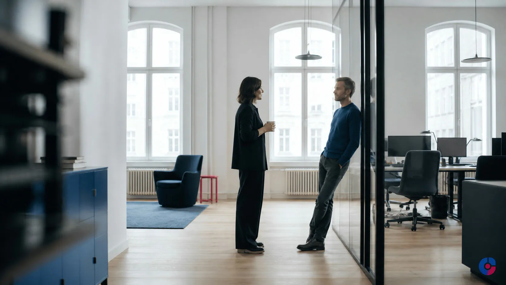 European operations team discussing offshore staffing plans in a bright modern office