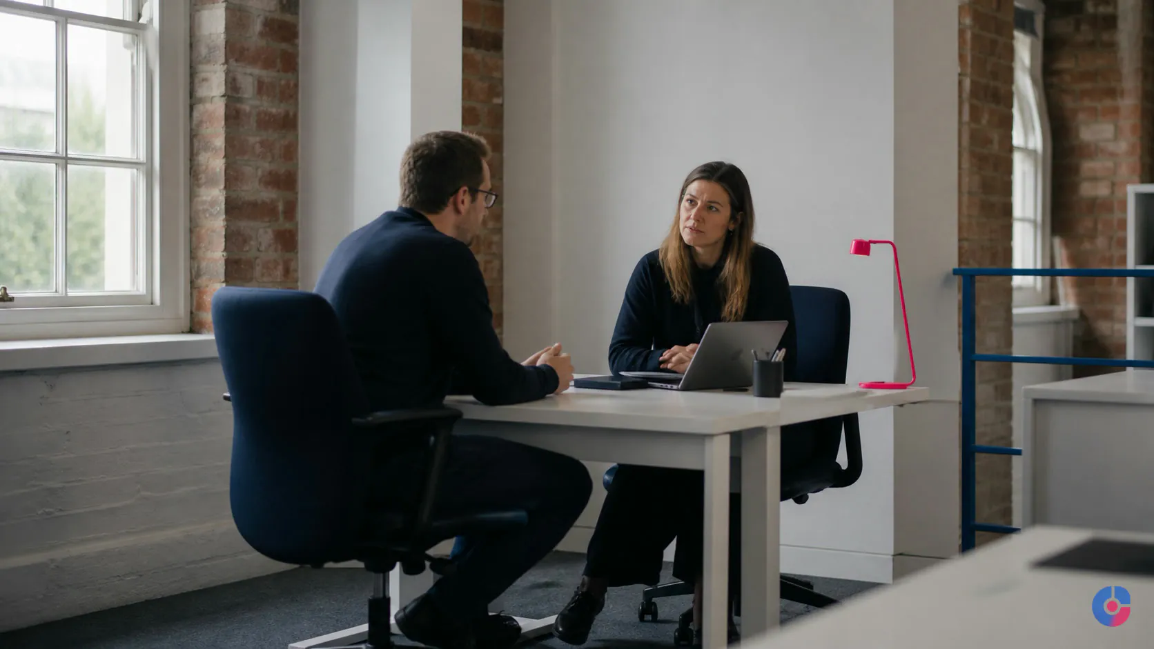 UK business team discussing how to structure a compliant remote staffing arrangement