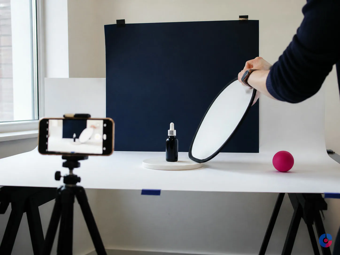 Small social media content shoot with a phone on a tripod and reflector