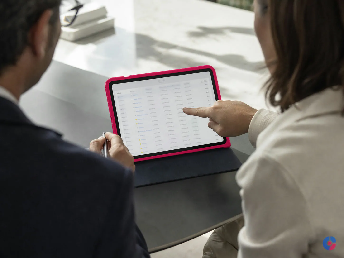 Colleagues reviewing timesheet approvals before payroll processing